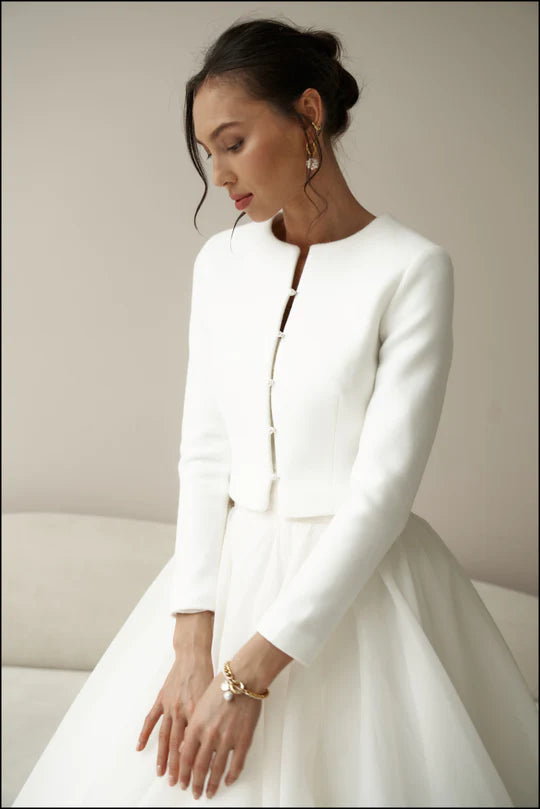 Bridal jacket in classic style with pearl buttons. Wedding coat for bride.