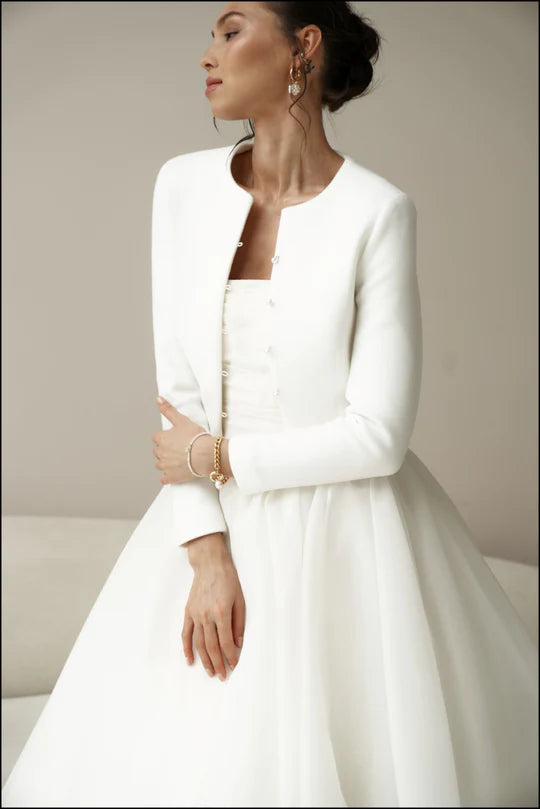Bridal jacket in classic style with pearl buttons. Wedding coat for bride.
