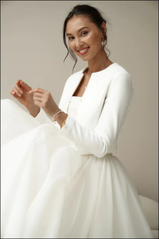 Bridal jacket in classic style with pearl buttons. Wedding coat for bride.