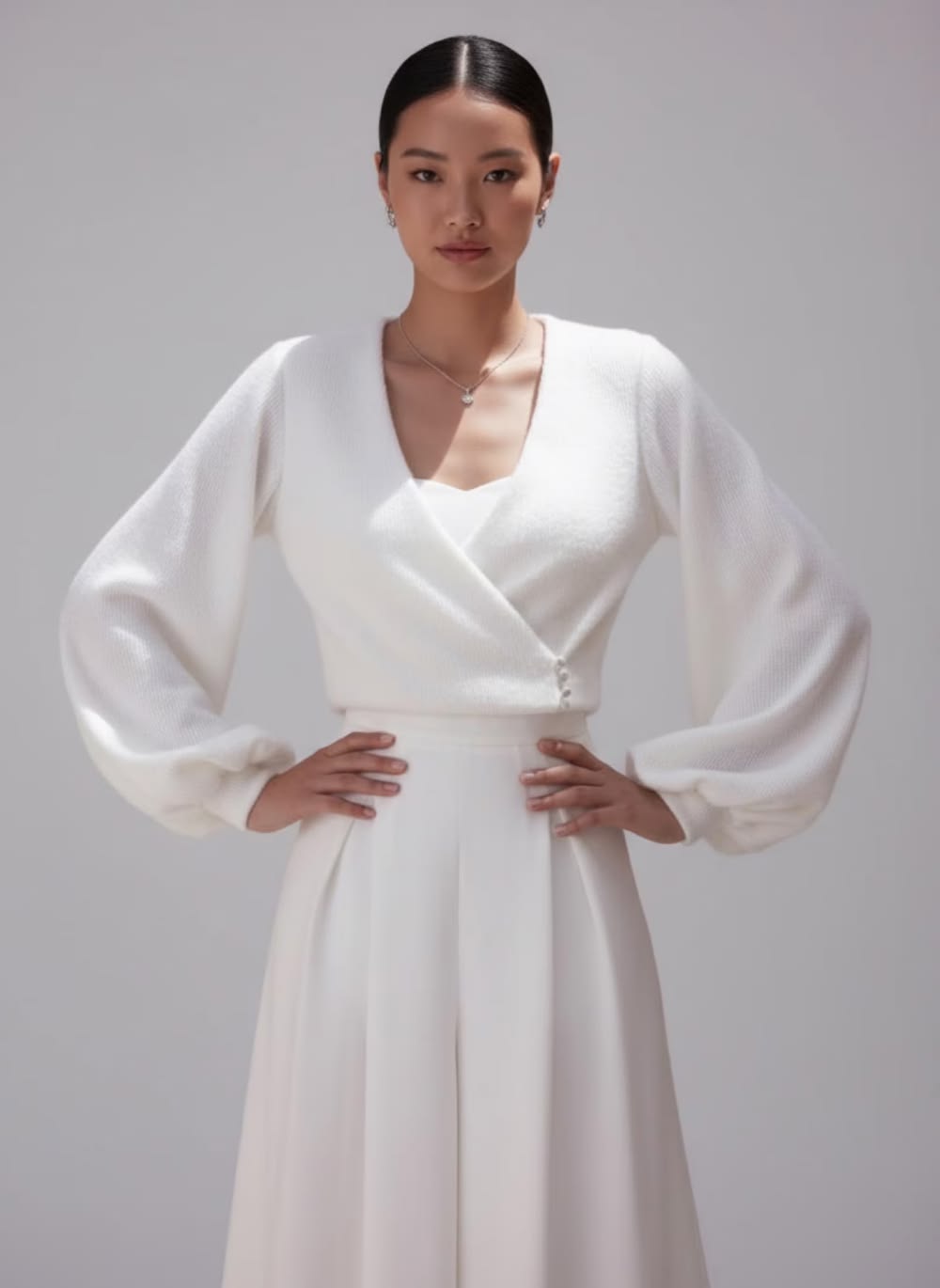 Elegant ivory angora bridal jacket with lining, long sleeves and a feminine wrap silhouette. A soft wedding cover up for modern and winter brides.