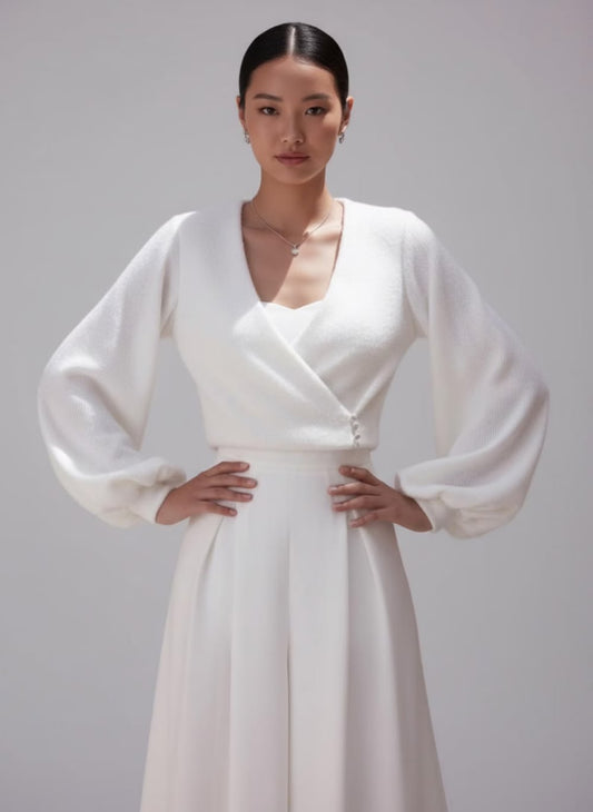Elegant ivory angora bridal jacket with lining, long sleeves and a feminine wrap silhouette. A soft wedding cover up for modern and winter brides.
