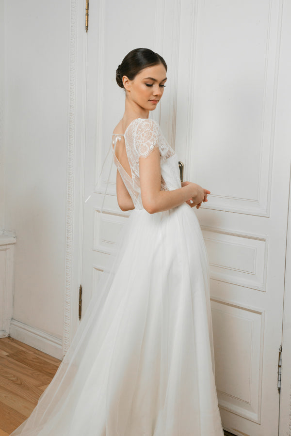 Side back view of Adele wedding dress with lace bodice and tulle skirt