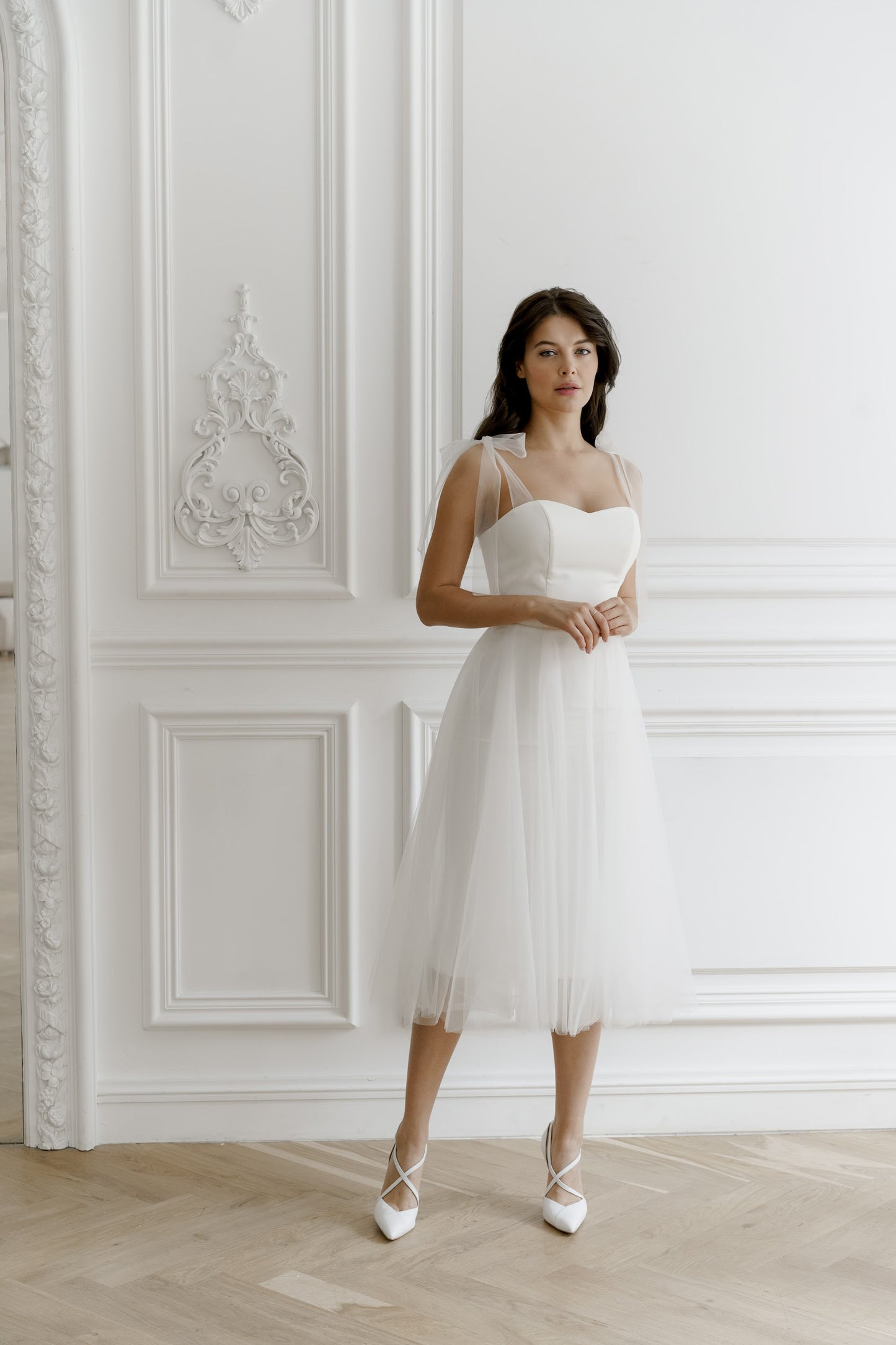 Bride in a full midi tulle wedding dress over satin, mid-calf length
