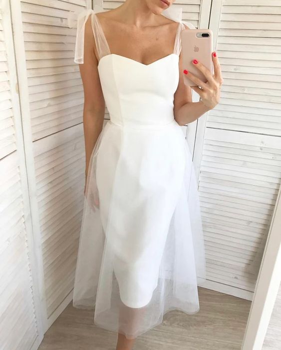 Sweetheart satin bodice with sheer tulle tie straps and tulle skirt
