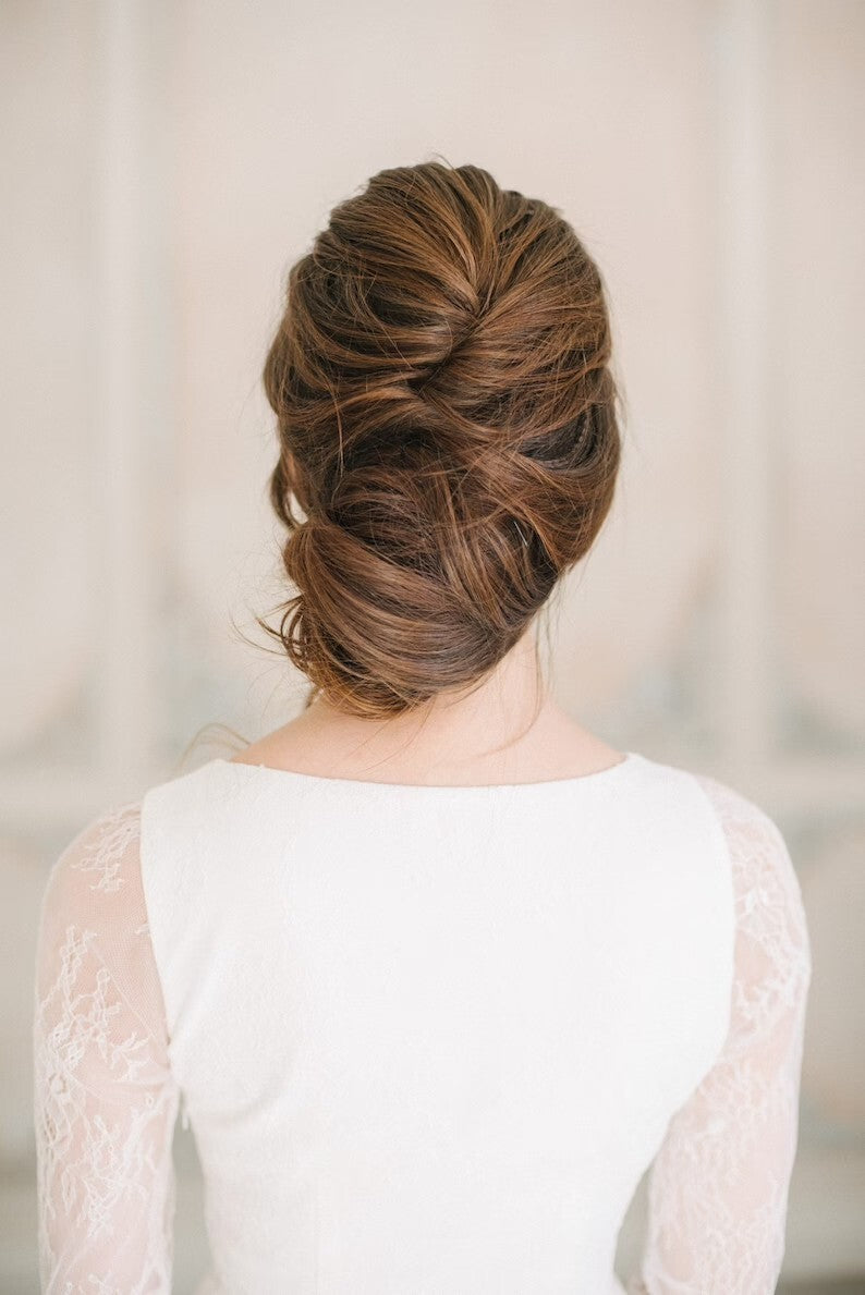 Back view of Anna wedding dress showing lace sleeves and high neckline