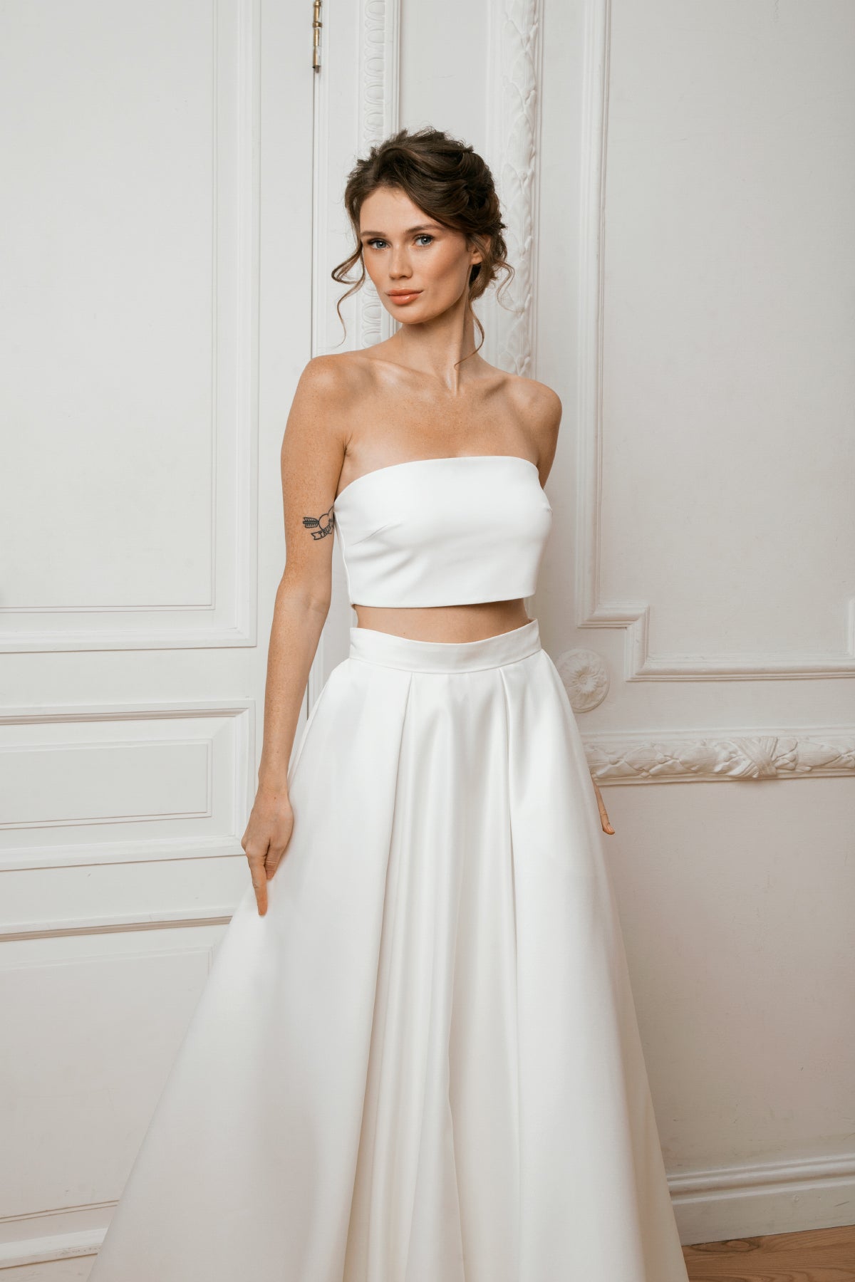 Bride in a two-piece mikado bridal set with a crop top and high-waisted A-line skirt