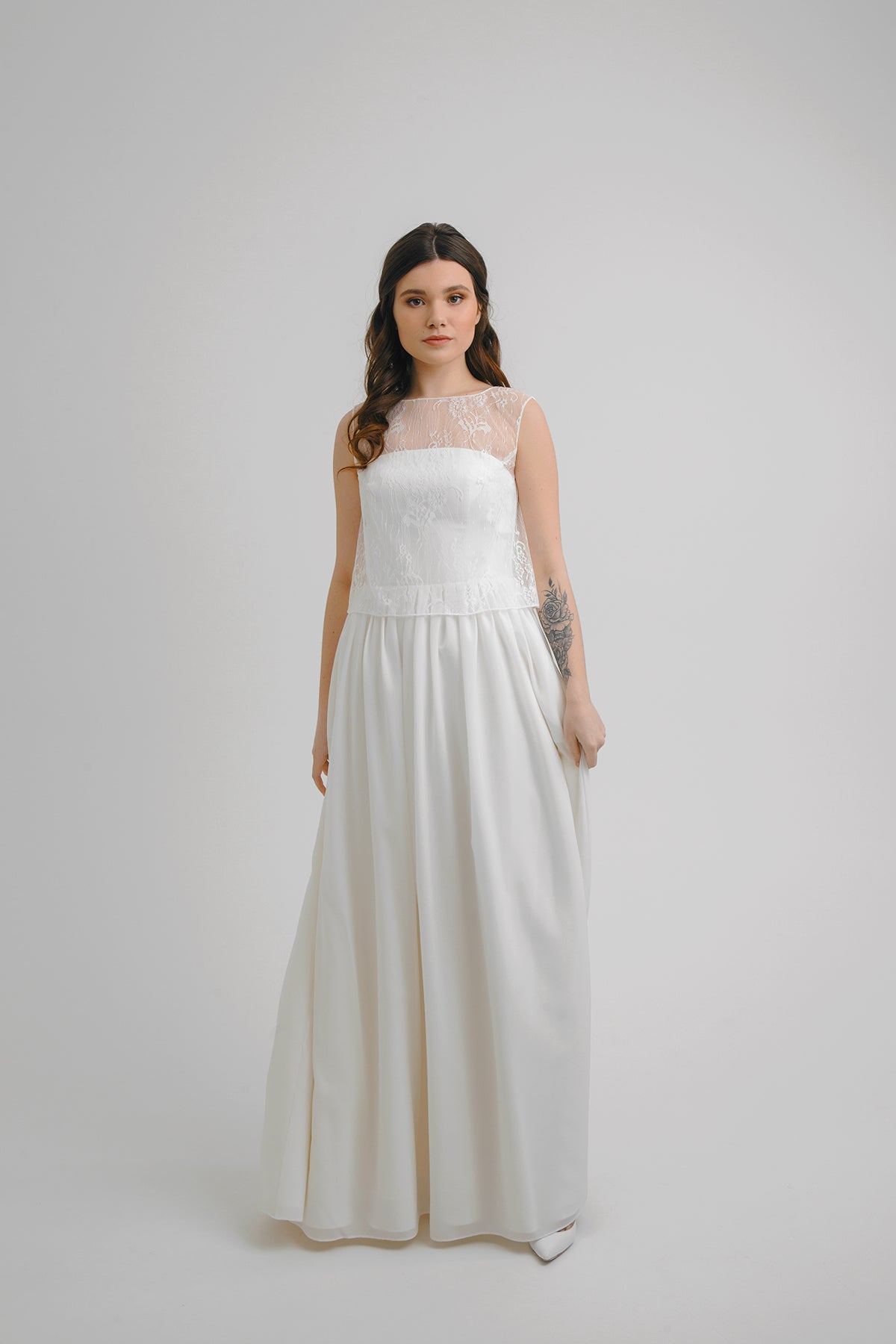 Aurora crepe wedding dress, front view with floral lace yoke and illusion neckline