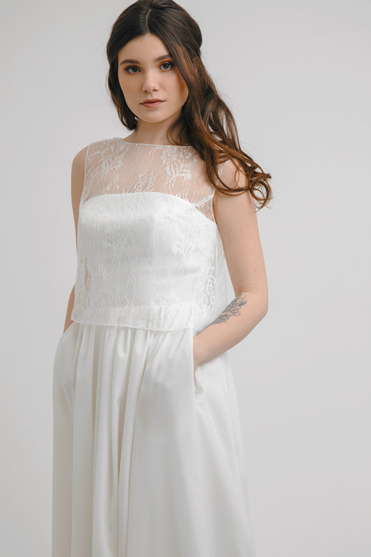 Aurora wedding dress front detail with lace yoke over crepe bodice