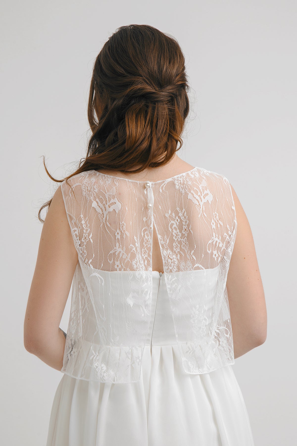 Close-up of Aurora's keyhole back with two pearl buttons