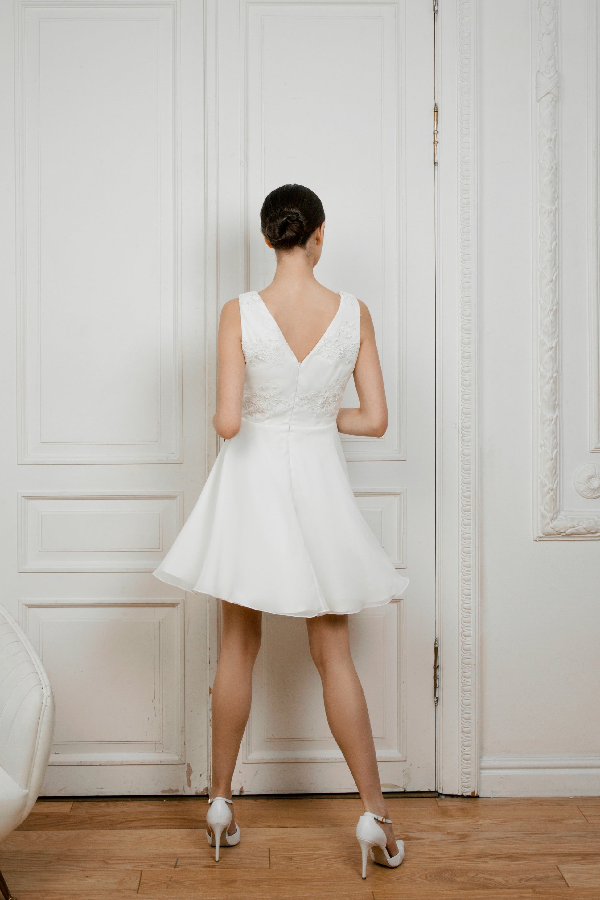 Back view of Caroline short wedding dress showing open V back and flared skirt