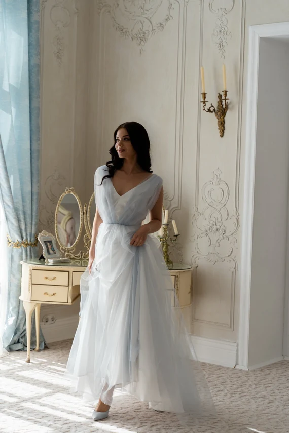 Ciel blue tulle wedding dress full length in an elegant interior
