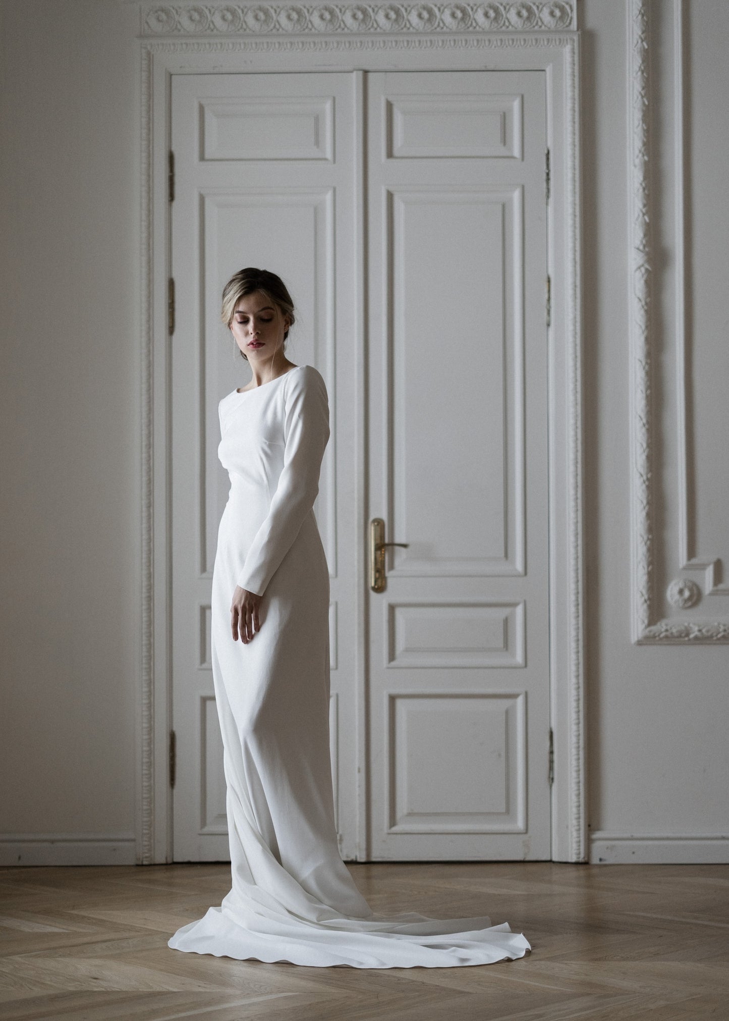 Colette matte crepe wedding dress, front view with high neck and long sleeves