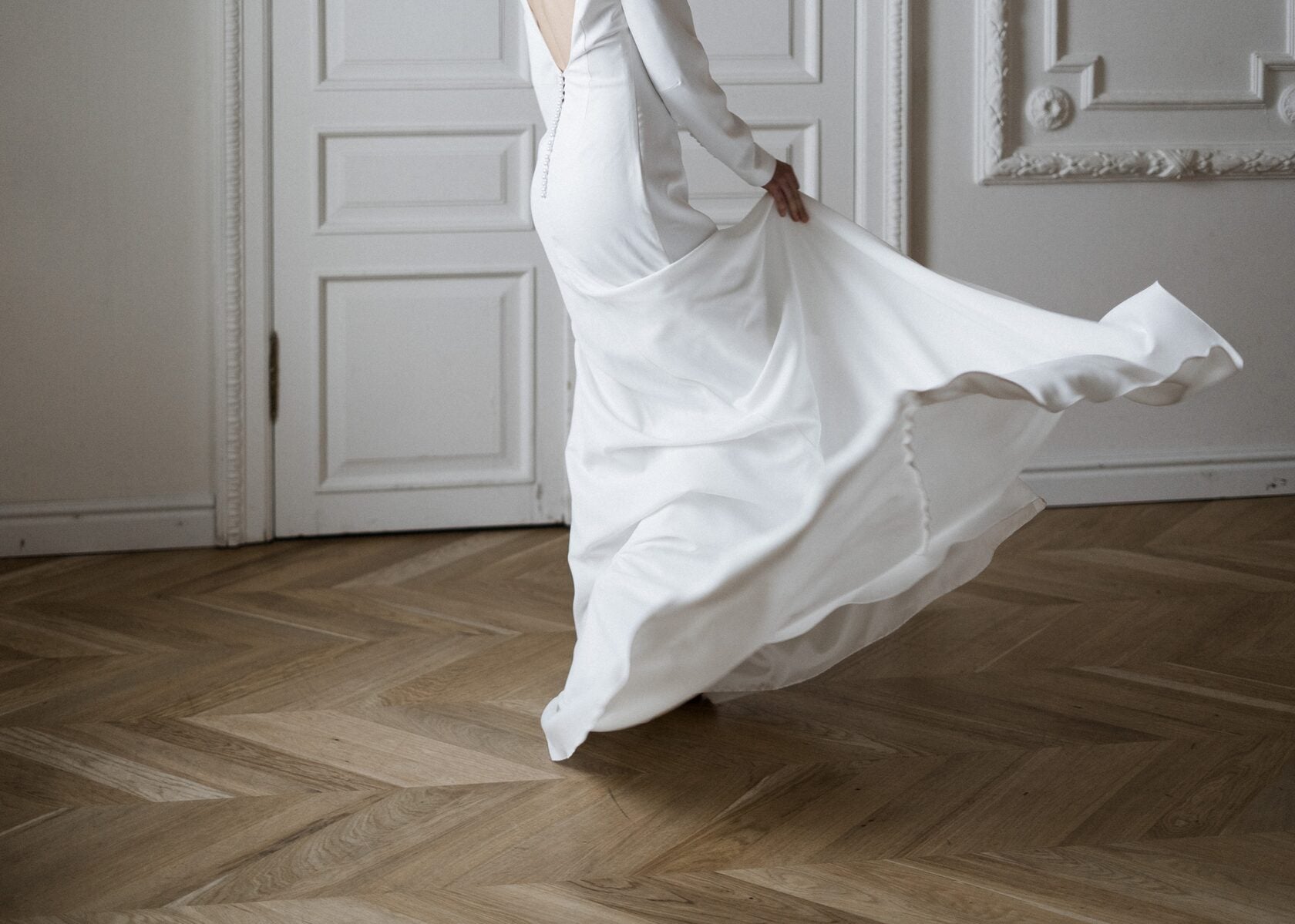 Colette wedding dress skirt in motion showing matte crepe