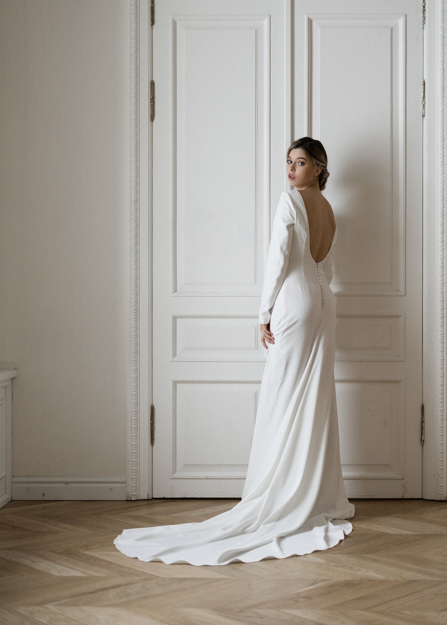 Colette crepe wedding dress with sweep train, back view
