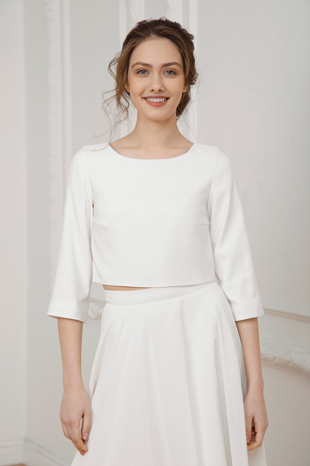 Royal crepe crop top with a boat neckline and three-quarter sleeves