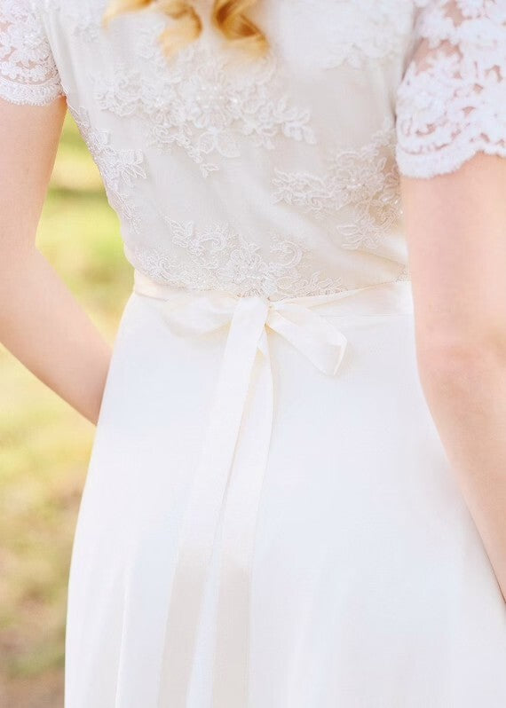 Ribbon tie at the waist of Flora wedding dress, back detail