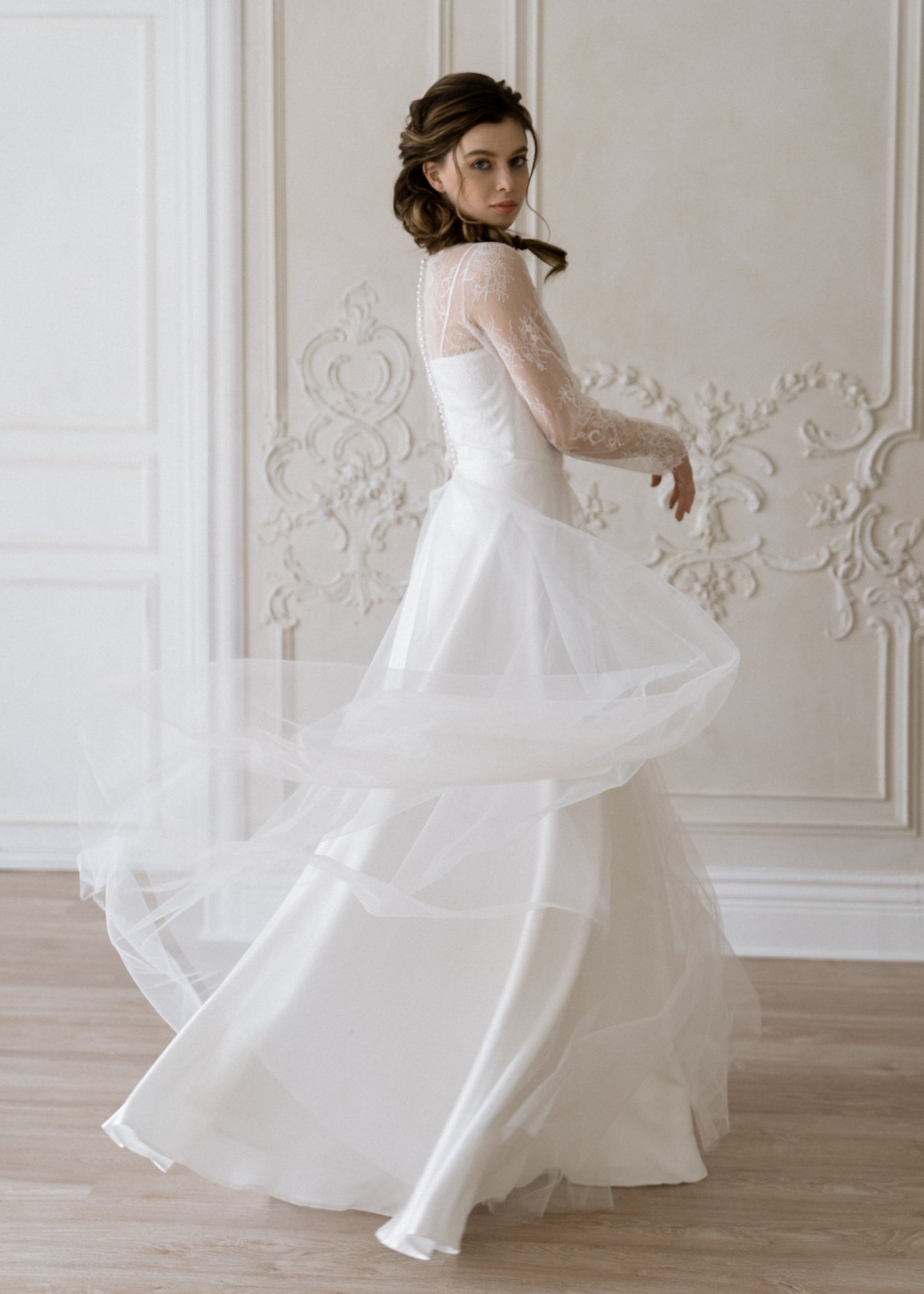 Josephine lace wedding dress skirt in motion with light train
