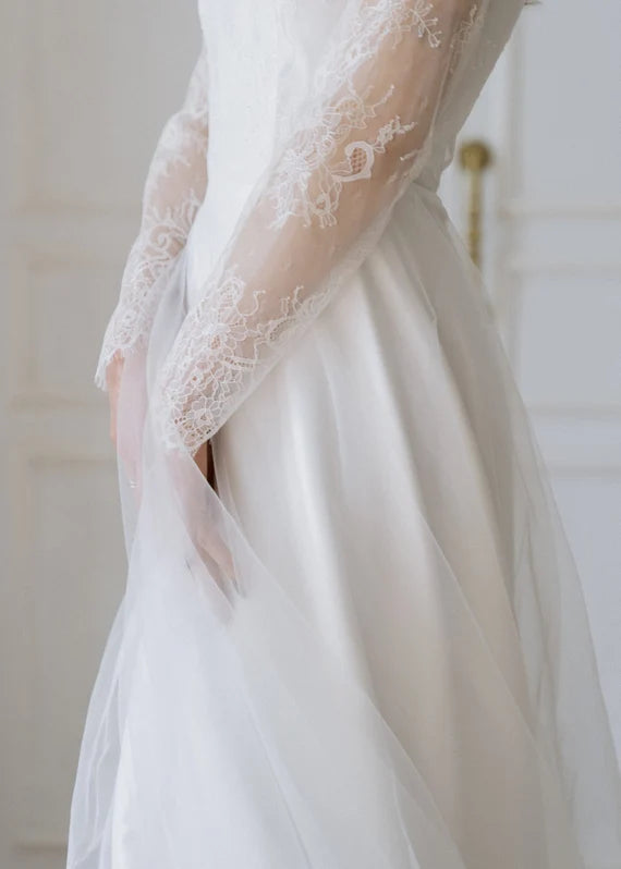 Detail of Josephine's lace sleeve and layered tulle skirt