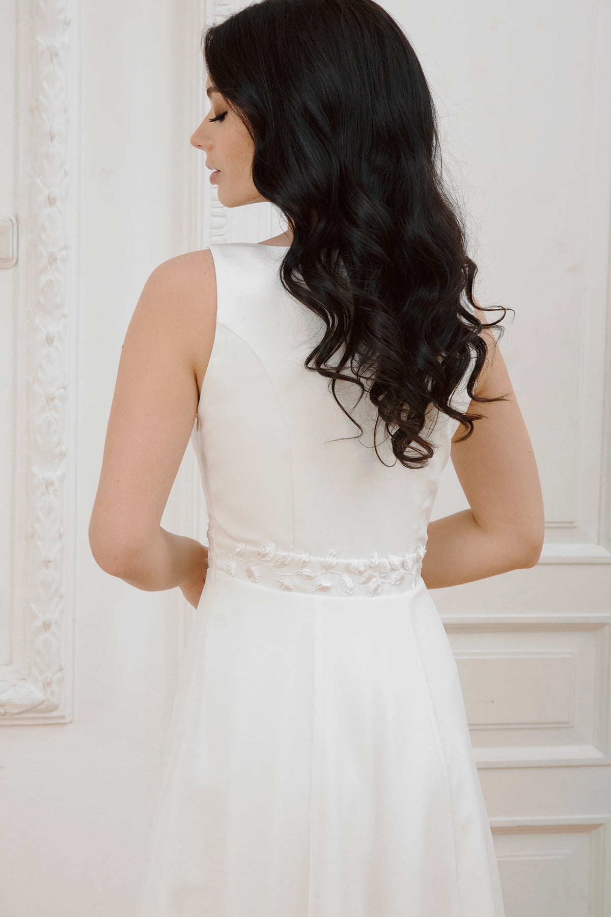Back detail of Nina wedding dress with embroidered waist belt