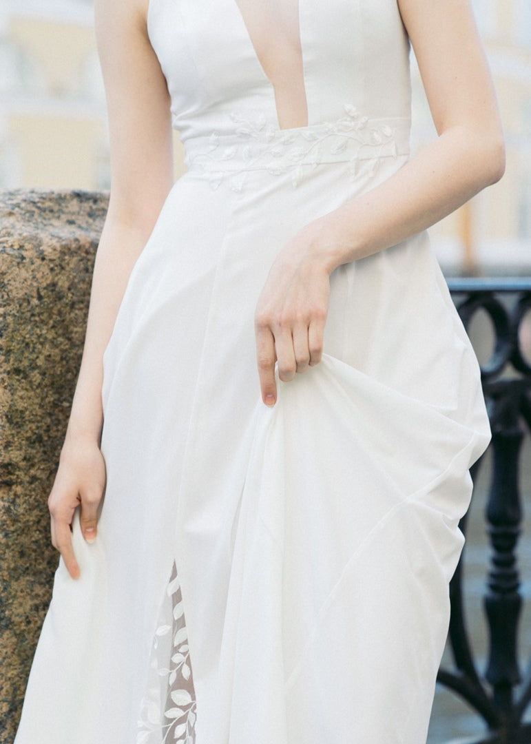 Nina wedding dress skirt detail showing hidden leaf-patterned lace inset