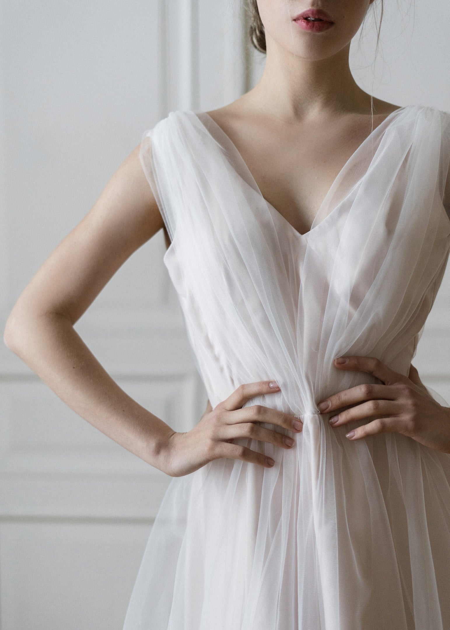 Detail of Peony's V-neckline and sheer tulle bodice