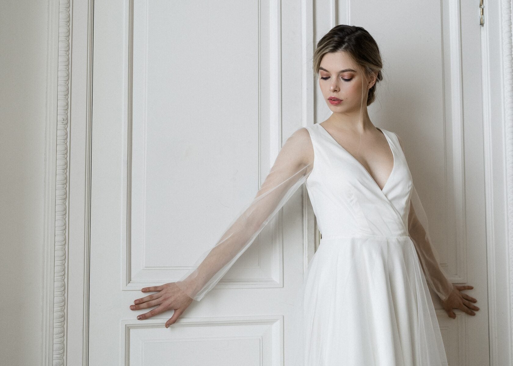 Tulipa wedding dress side view showing tulle sleeve and satin bodice