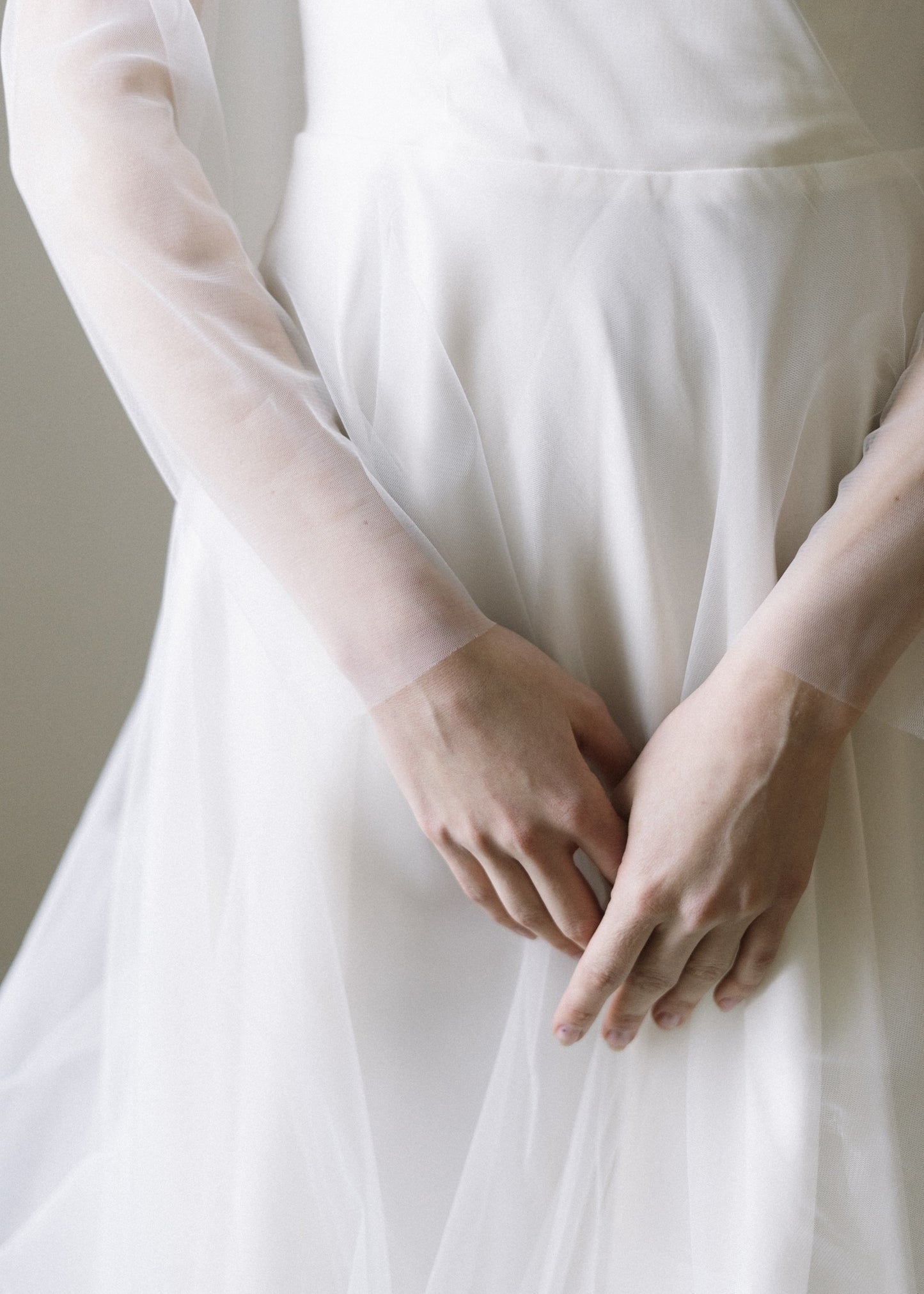 Detail of Tulipa's tulle skirt and sheer tulle sleeves