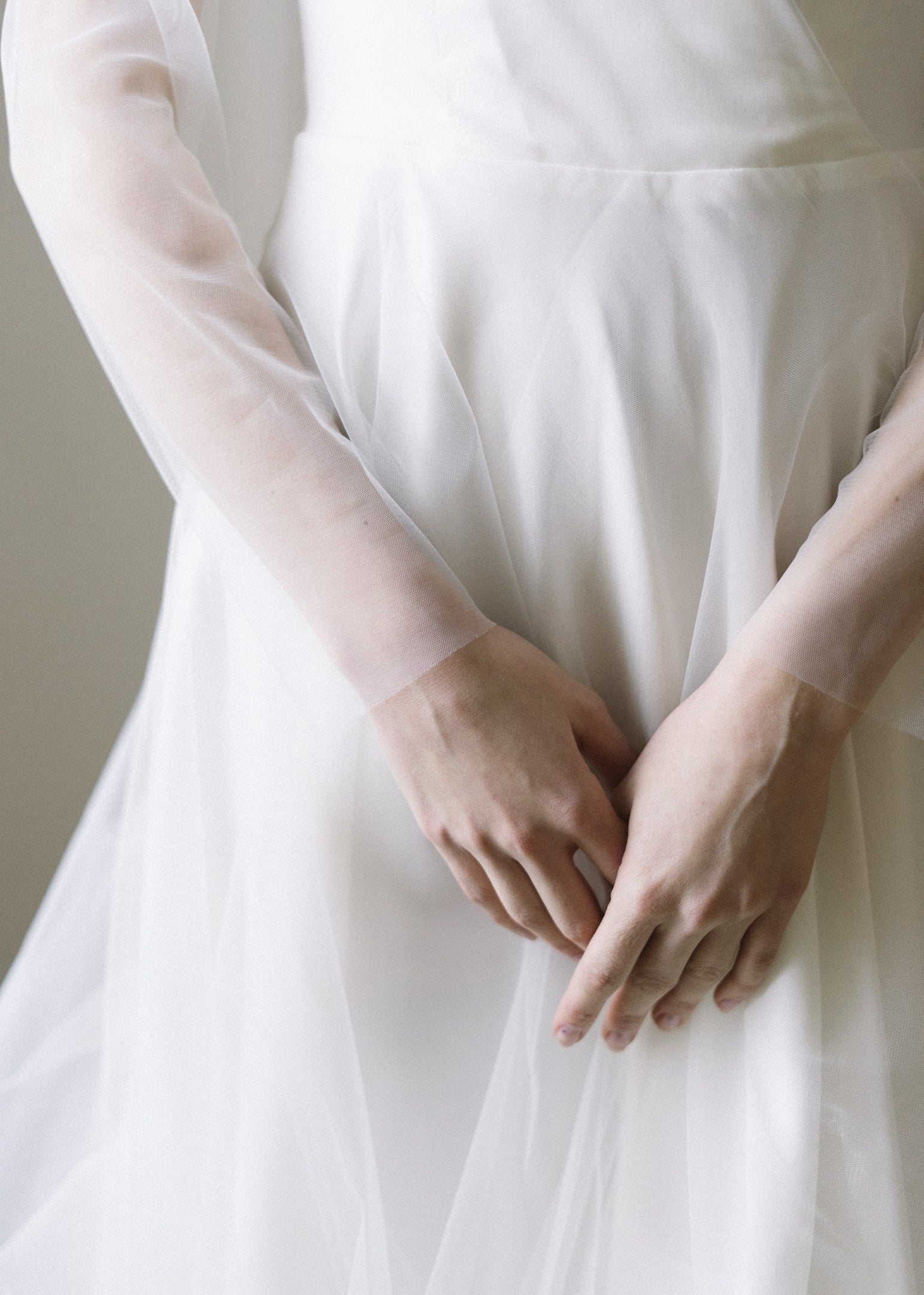 Detail of Tulipa's tulle skirt and sheer tulle sleeves