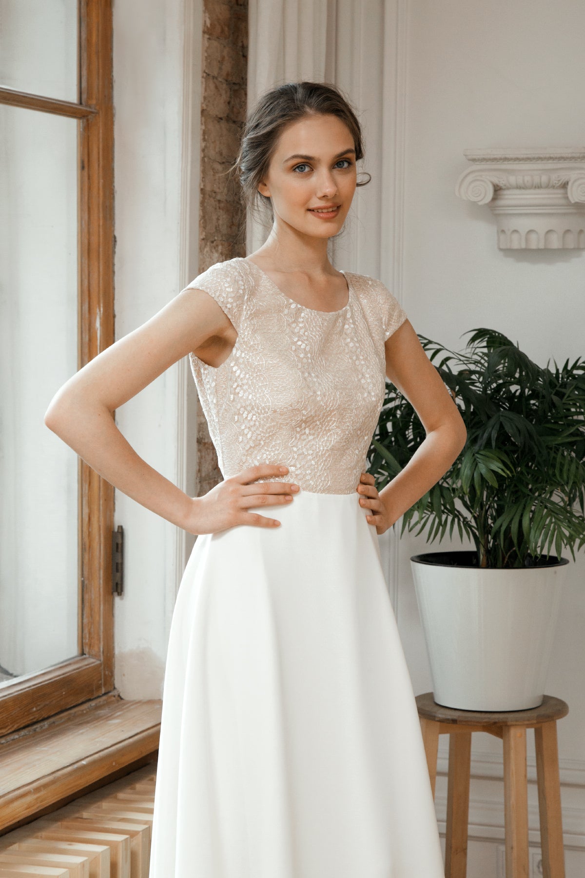 Una wedding dress bodice detail showing sequinned champagne fabric and scoop neckline