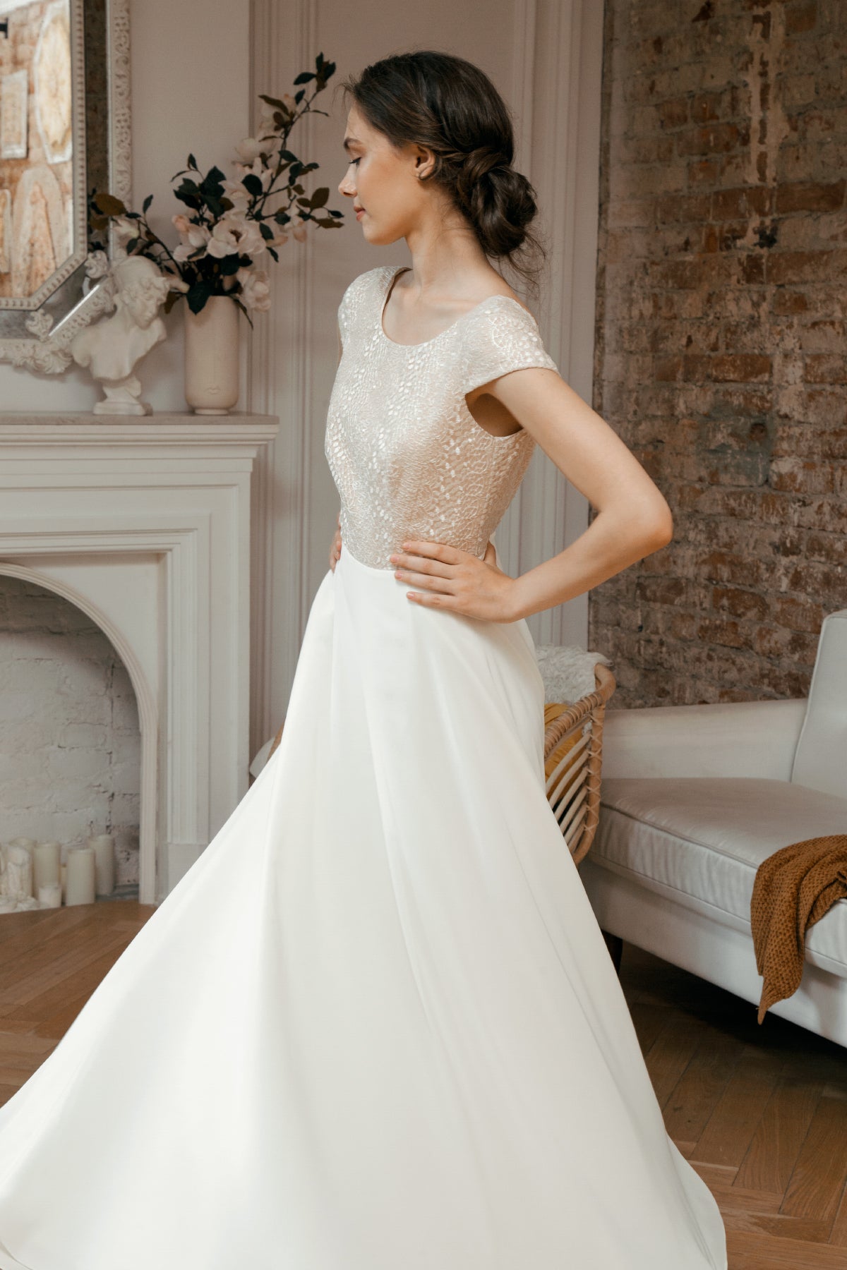 Side view of Una wedding dress showing cap sleeves and smooth skirt
