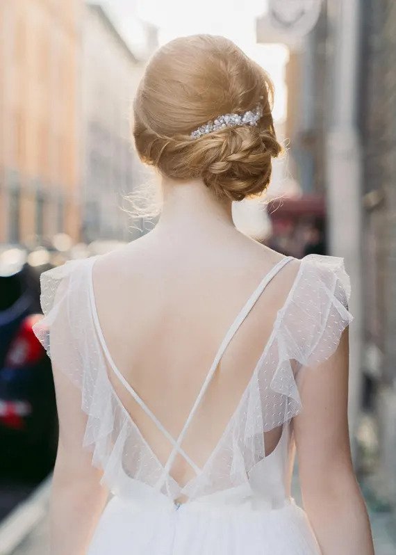 Back detail of Whisper of the Wind dress showing crossed straps and dotted tulle flutters