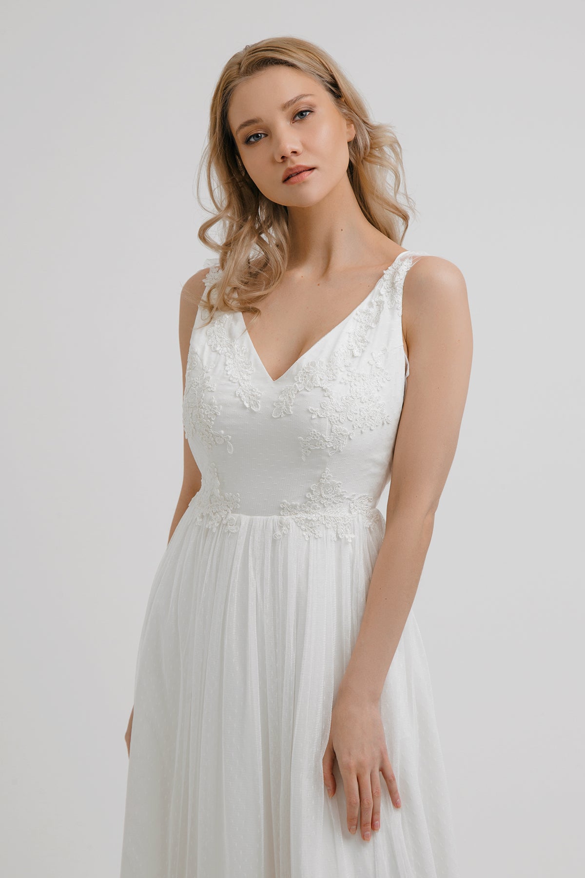 Whisper of the Wind wedding dress bodice detail showing floral lace and V-neckline