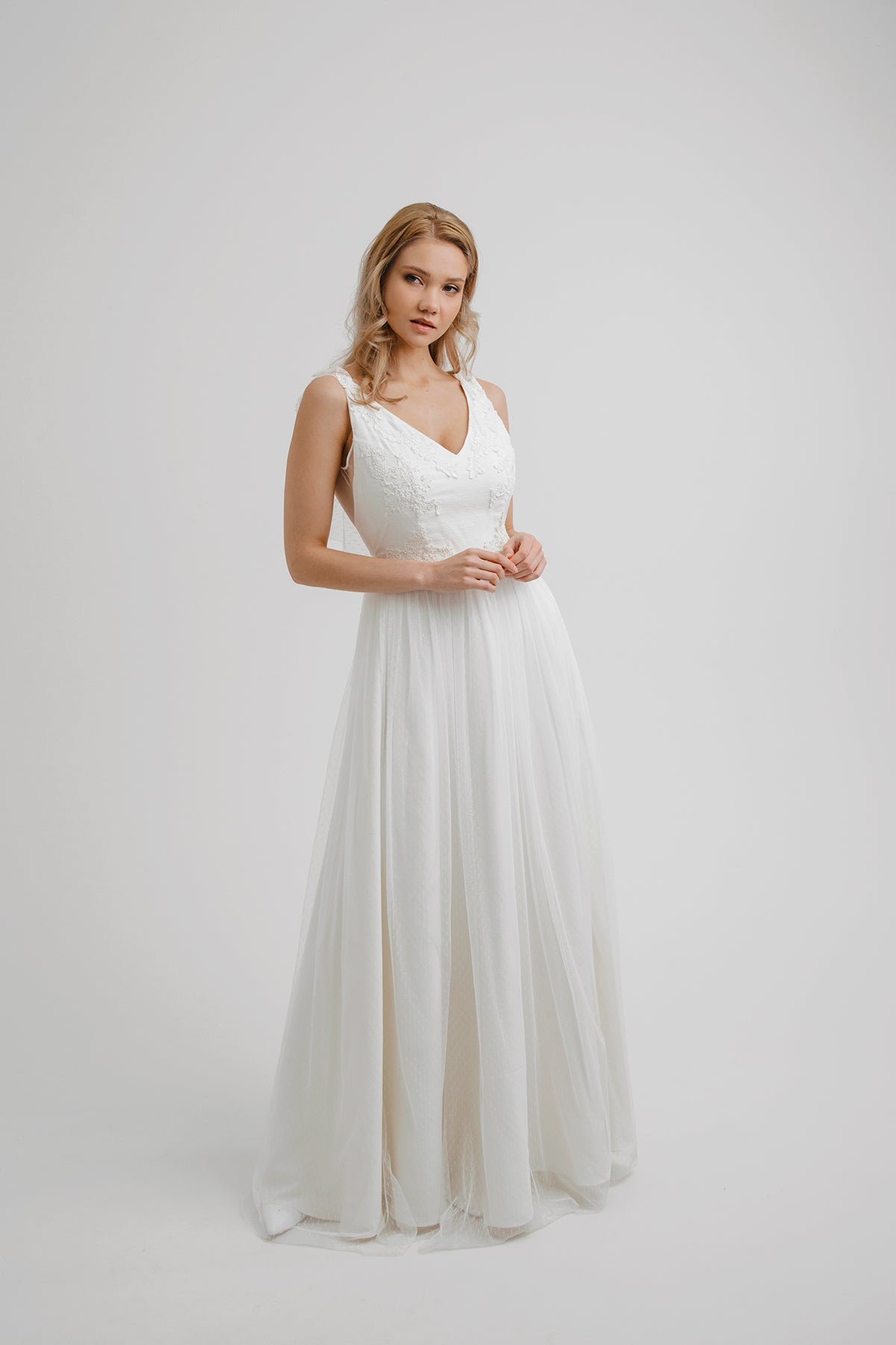 Whisper of the Wind wedding dress, front view in dotted tulle with V-neckline and floral lace bodice