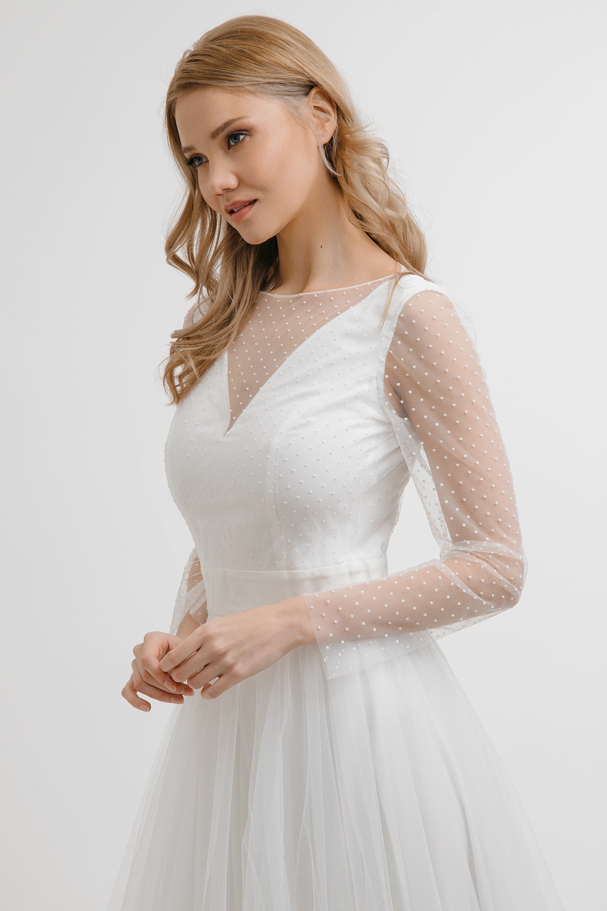 White Orchid wedding dress bodice detail with polka-dot tulle sleeves and illusion neckline