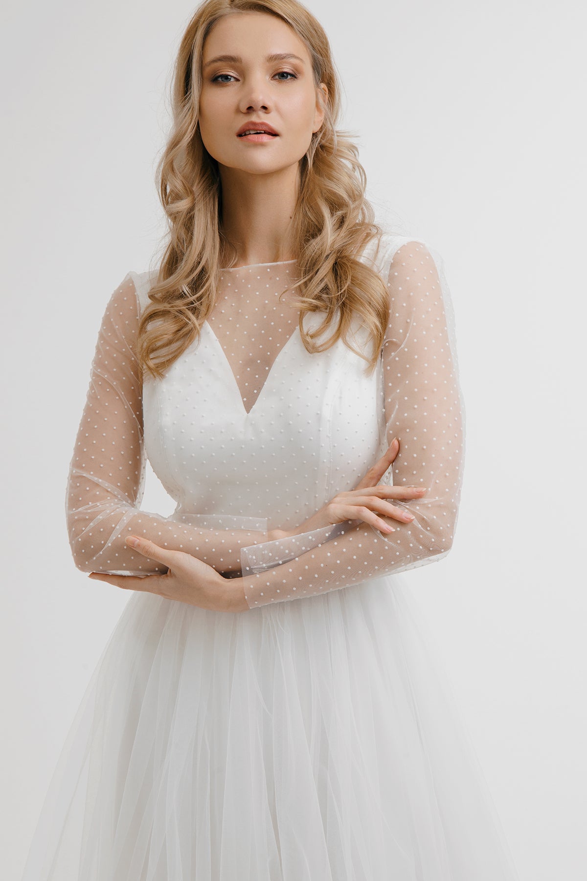 White Orchid wedding dress front detail with dotted tulle yoke and long sleeves